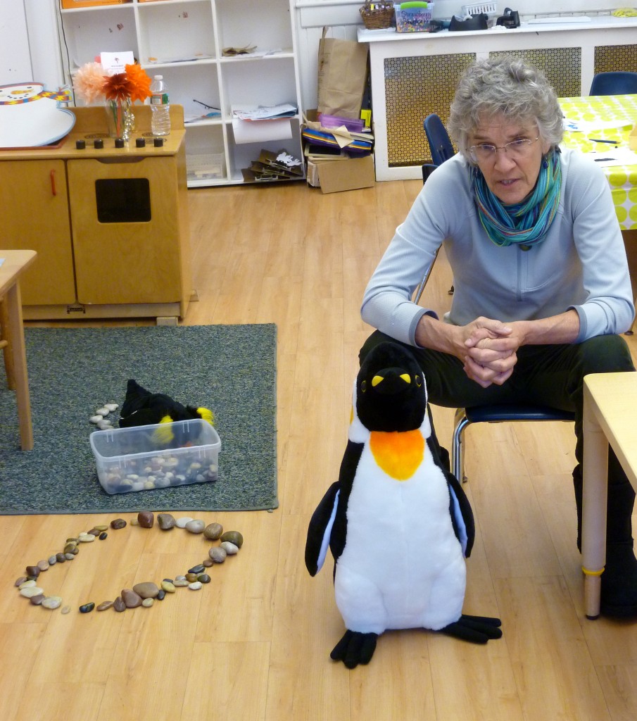 Sally talking to the class. The children are building an Adelie penguin's nest out of stones.