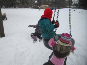 the snow makes it easier to climb up onto the tire swing