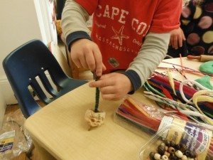 Attaching bead shoes to pipe cleaners.