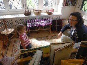 Noelle and her grandmother look at books.