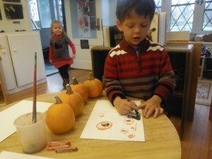 Drawing pumpkins.