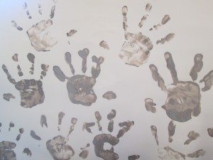 Muddy hand prints.