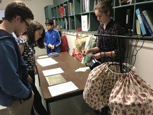 9th Graders at hearing a about a colonial-era artifact and authentic document at the 7th Grade Colonial Fair, that included a project, a written paper, and an oral presentation